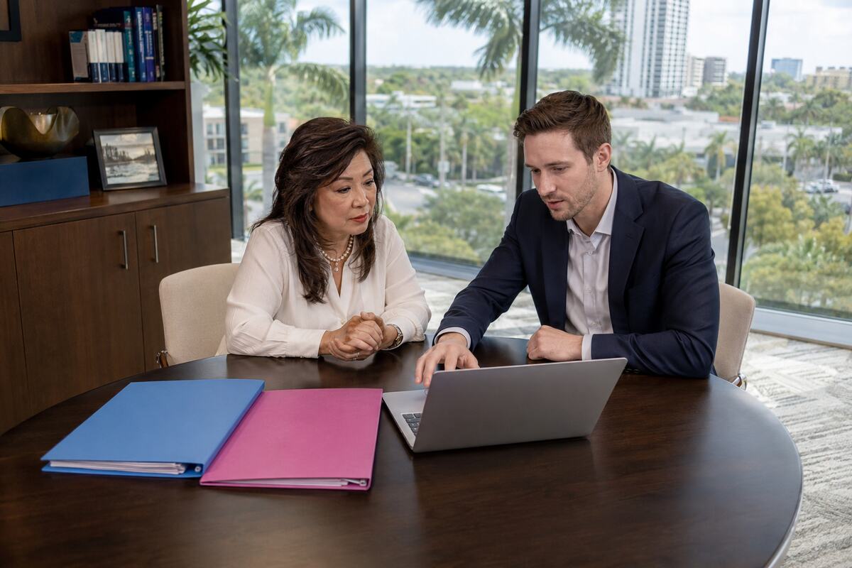 Business owner reviewing subsidiary ownership and intercompany accounting records