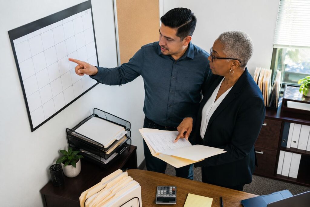 Tax Advisor Fort Lauderdale reviewing business tax election deadlines with an owner