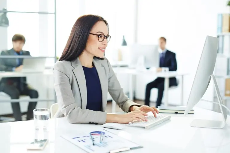 Accountant working at a computer in the CPA Firm South Florida office